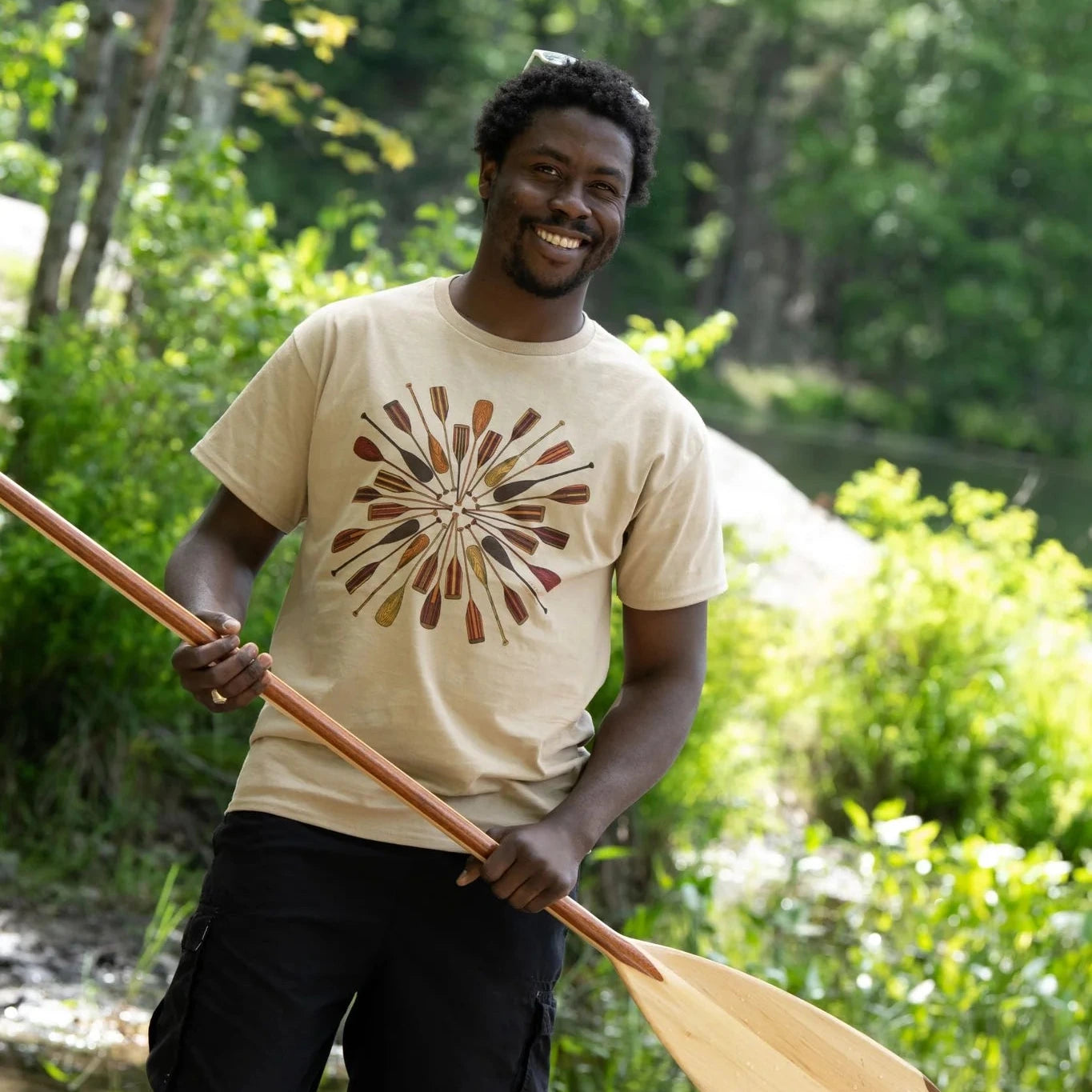 Person wearing a canoe paddles t-shirt (unisex)