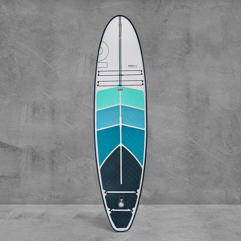 Sup board with blue and white design on a gray background
