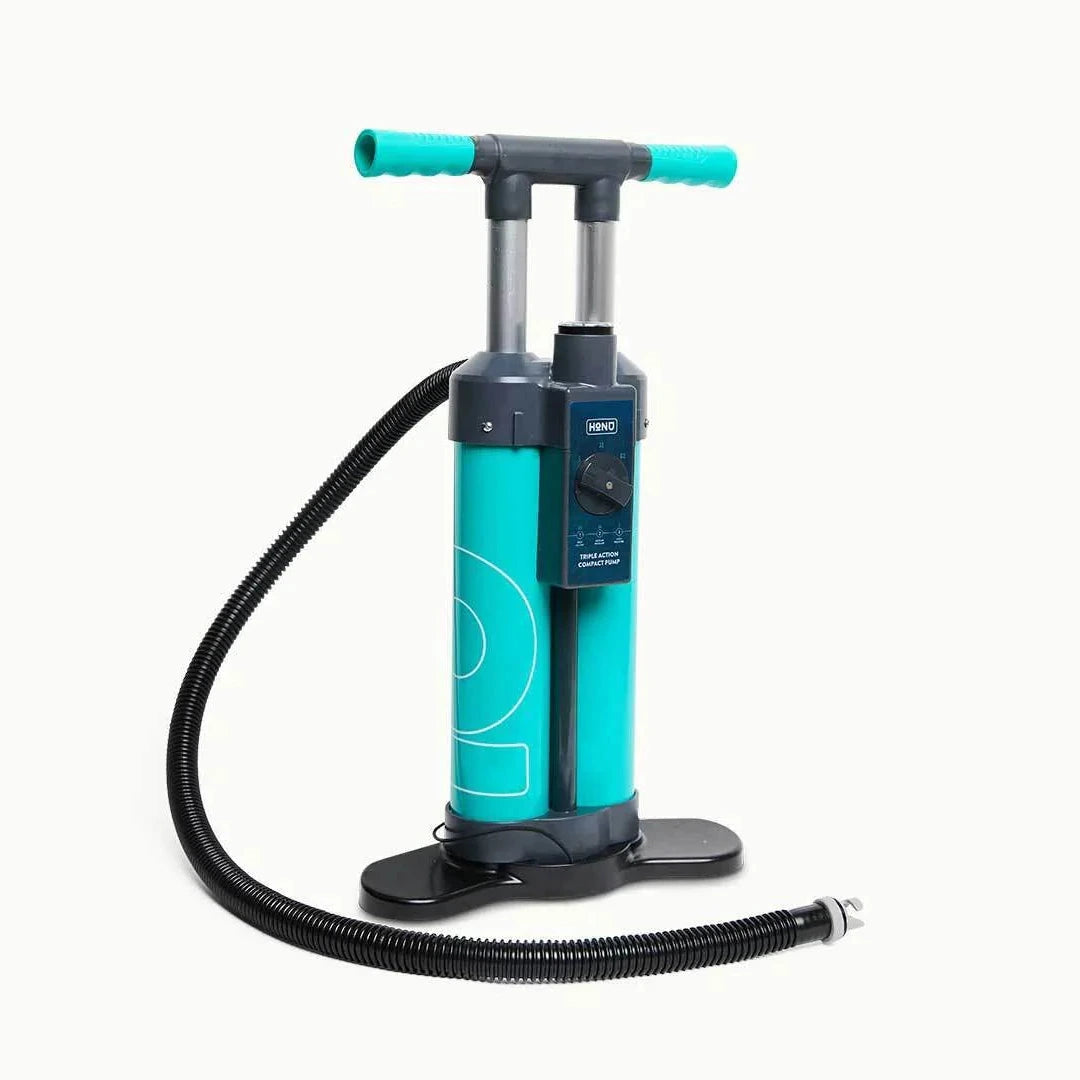 Turquoise hand pump with black hose on a white background